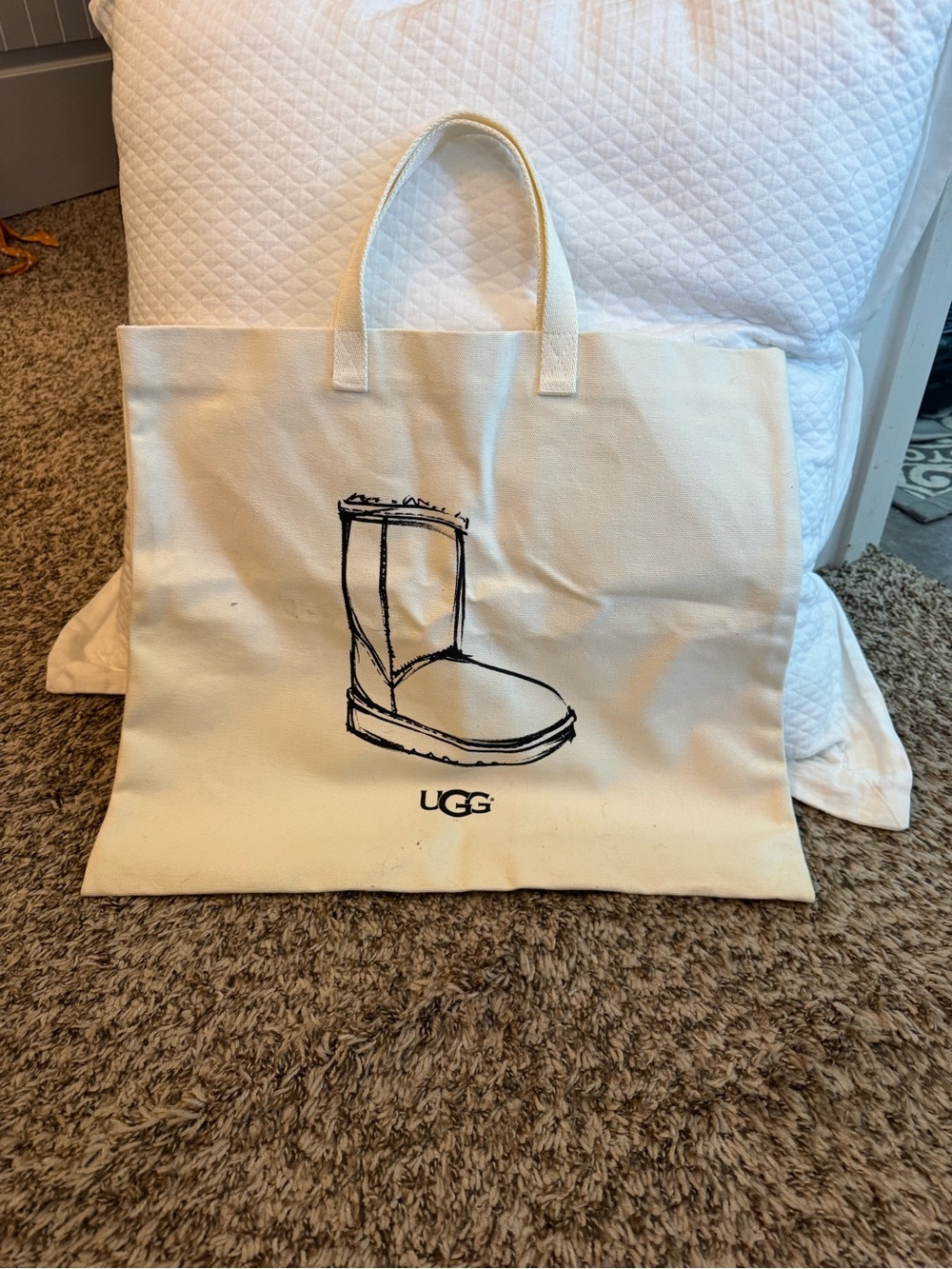 UGG Cream Canvas Tote with Black Boot Illustration